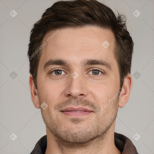 Joyful white adult male with short  brown hair and brown eyes