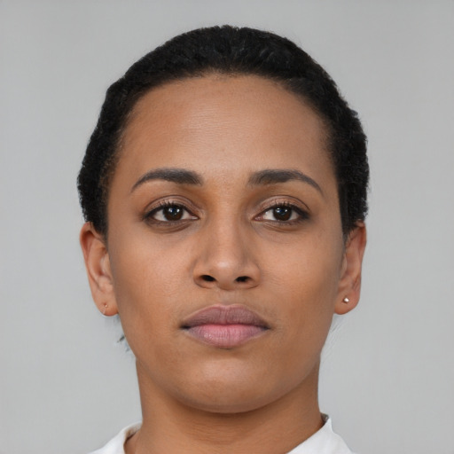 Neutral latino young-adult female with short  black hair and brown eyes