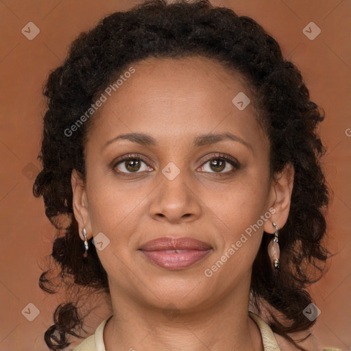 Joyful black young-adult female with medium  brown hair and brown eyes