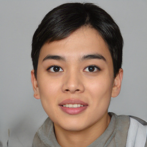 Joyful asian young-adult female with short  black hair and brown eyes