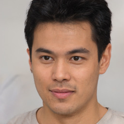 Neutral asian young-adult male with short  brown hair and brown eyes