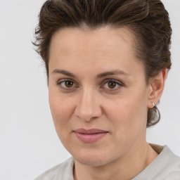 Joyful white adult female with short  brown hair and brown eyes