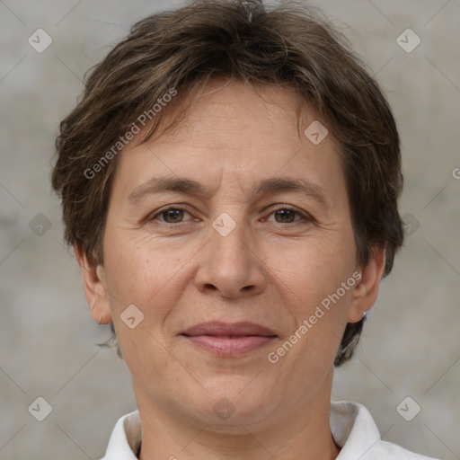 Joyful white adult female with short  brown hair and brown eyes