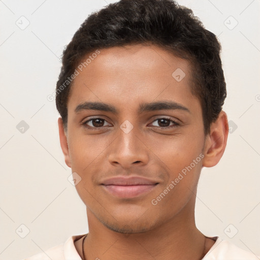 Joyful latino young-adult male with short  brown hair and brown eyes