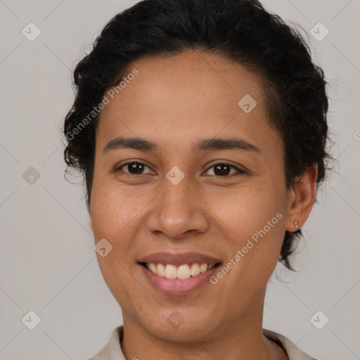 Joyful latino young-adult female with short  brown hair and brown eyes