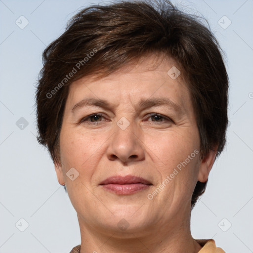 Joyful white adult female with short  brown hair and brown eyes