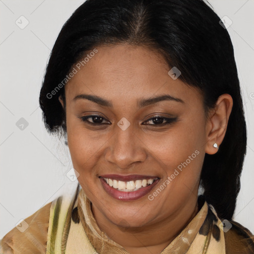 Joyful latino young-adult female with medium  brown hair and brown eyes