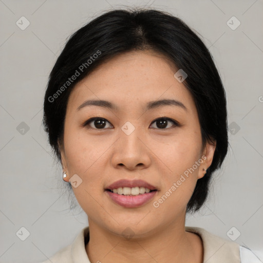 Joyful asian young-adult female with medium  black hair and brown eyes