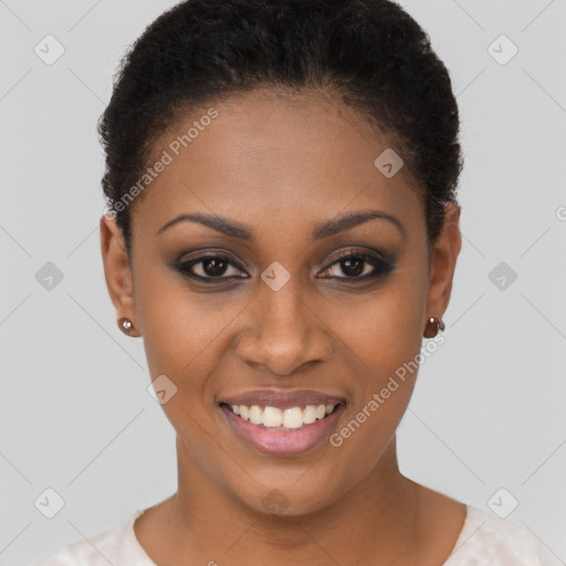 Joyful black young-adult female with short  brown hair and brown eyes