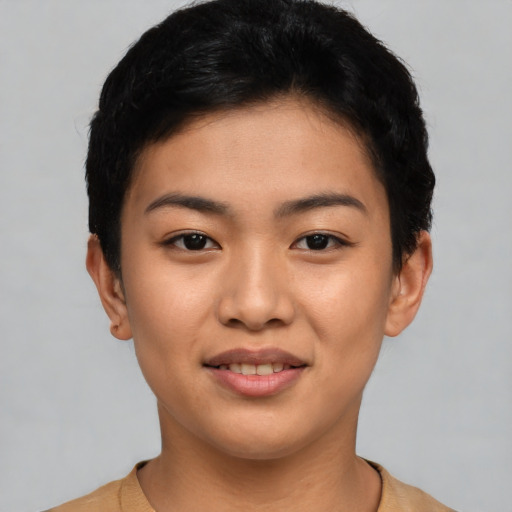 Joyful asian young-adult female with short  black hair and brown eyes