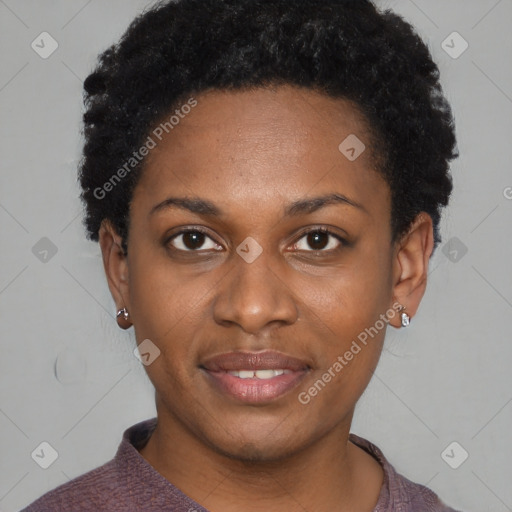 Joyful black young-adult female with short  black hair and brown eyes