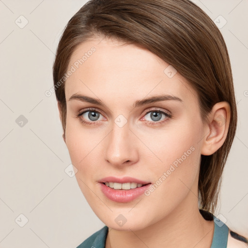 Joyful white young-adult female with medium  brown hair and blue eyes