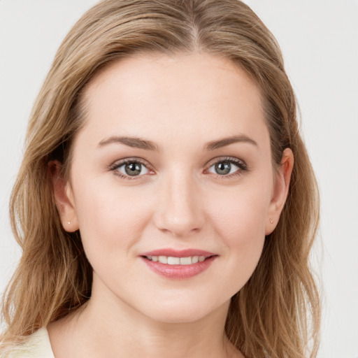 Joyful white young-adult female with medium  brown hair and blue eyes