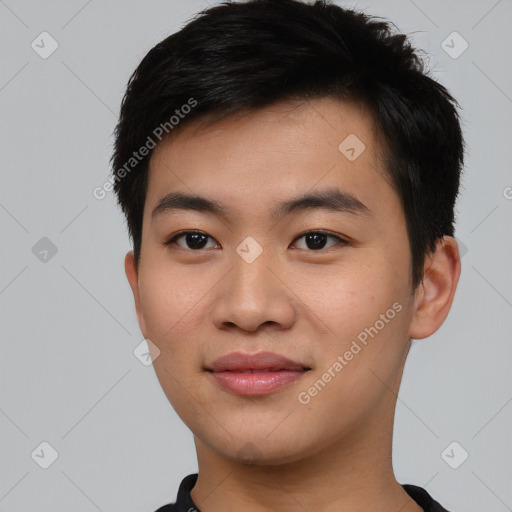 Joyful asian young-adult male with short  black hair and brown eyes