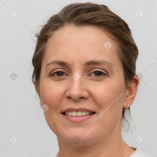 Joyful white adult female with short  brown hair and grey eyes