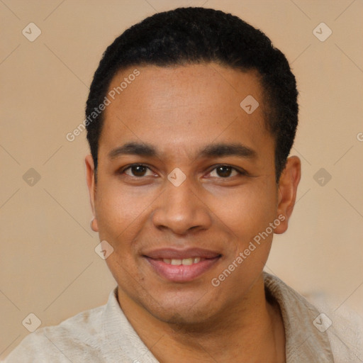 Joyful latino young-adult male with short  black hair and brown eyes