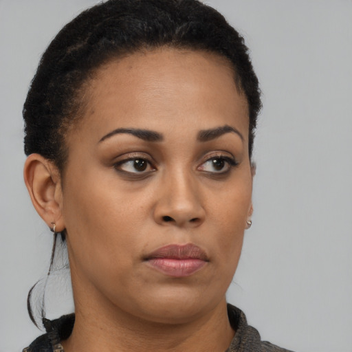 Neutral black young-adult female with short  brown hair and brown eyes