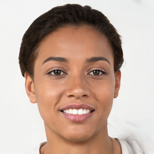 Joyful white young-adult female with short  brown hair and brown eyes