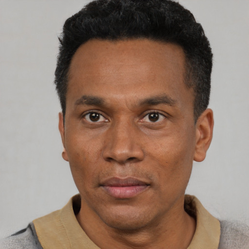 Neutral latino adult male with short  black hair and brown eyes