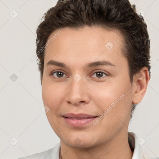 Joyful white young-adult female with short  brown hair and brown eyes