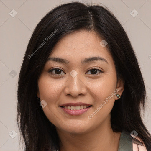 Joyful asian young-adult female with long  brown hair and brown eyes