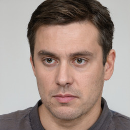 Neutral white adult male with short  brown hair and brown eyes