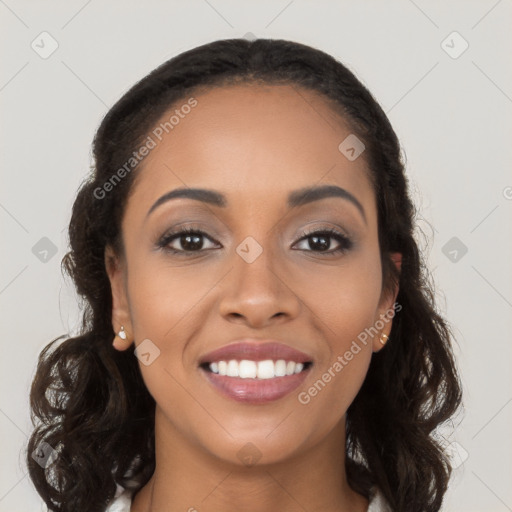 Joyful latino young-adult female with long  brown hair and brown eyes