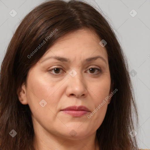 Joyful white adult female with long  brown hair and brown eyes