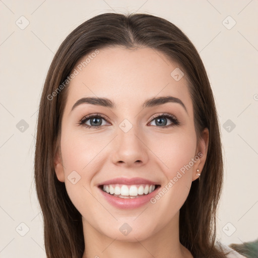 Joyful white young-adult female with long  brown hair and green eyes