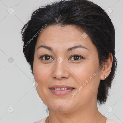 Joyful white adult female with medium  brown hair and brown eyes