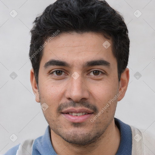 Joyful white young-adult male with short  black hair and brown eyes