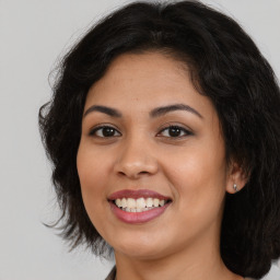 Joyful asian young-adult female with long  brown hair and brown eyes