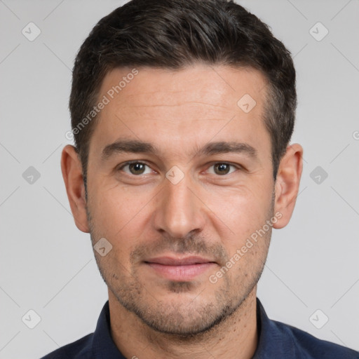 Joyful white young-adult male with short  brown hair and brown eyes