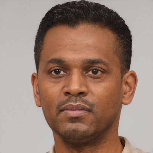 Neutral black young-adult male with short  black hair and brown eyes