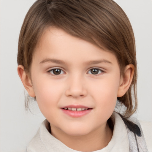 Joyful white child female with medium  brown hair and brown eyes