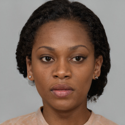 Neutral black young-adult female with short  brown hair and brown eyes