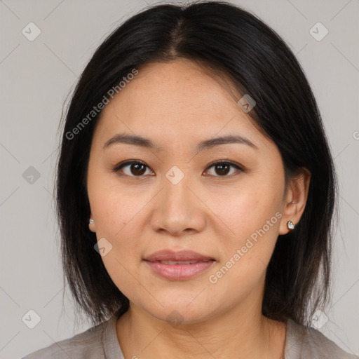 Joyful asian young-adult female with medium  brown hair and brown eyes