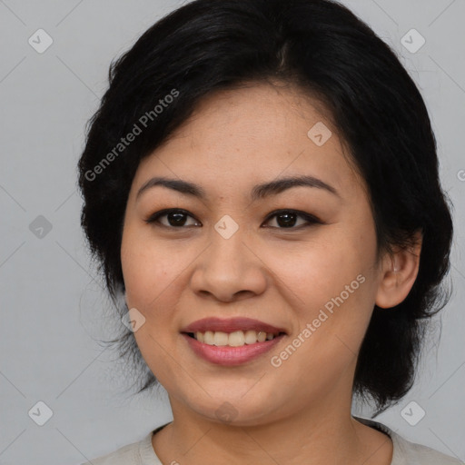 Joyful asian young-adult female with medium  black hair and brown eyes