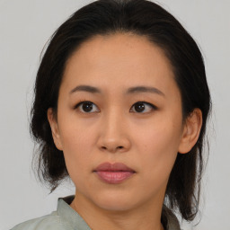 Neutral asian young-adult female with medium  brown hair and brown eyes