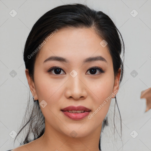 Joyful asian young-adult female with medium  black hair and brown eyes