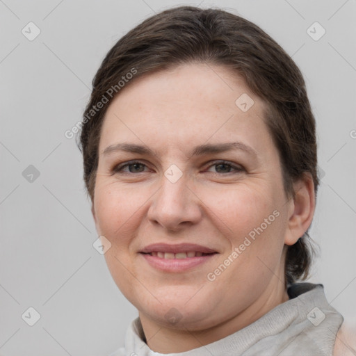 Joyful white adult female with short  brown hair and brown eyes