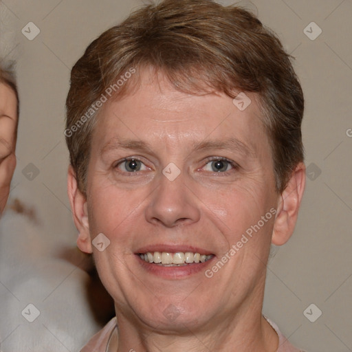 Joyful white adult male with short  brown hair and grey eyes