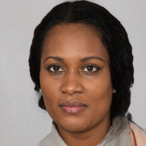 Neutral black adult female with medium  black hair and brown eyes