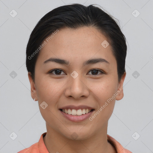 Joyful asian young-adult female with short  brown hair and brown eyes