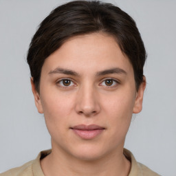 Neutral white young-adult female with short  brown hair and brown eyes