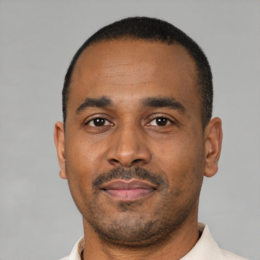 Neutral black young-adult male with short  black hair and brown eyes