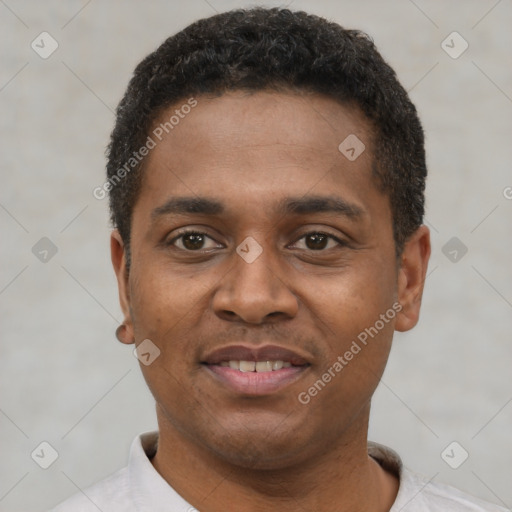 Joyful latino young-adult male with short  black hair and brown eyes