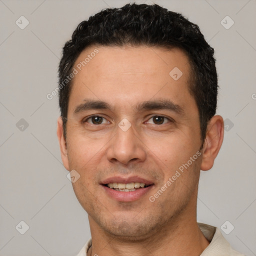 Joyful white young-adult male with short  black hair and brown eyes