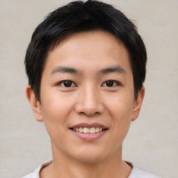 Joyful asian young-adult male with short  black hair and brown eyes