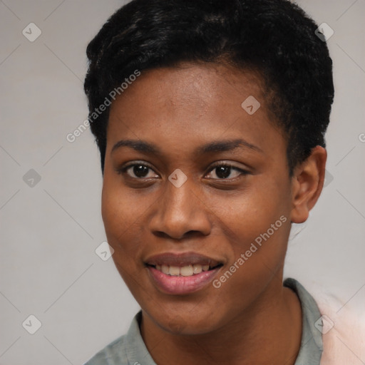 Joyful black young-adult female with short  black hair and brown eyes